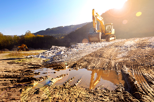 Excavator on a muddy ground